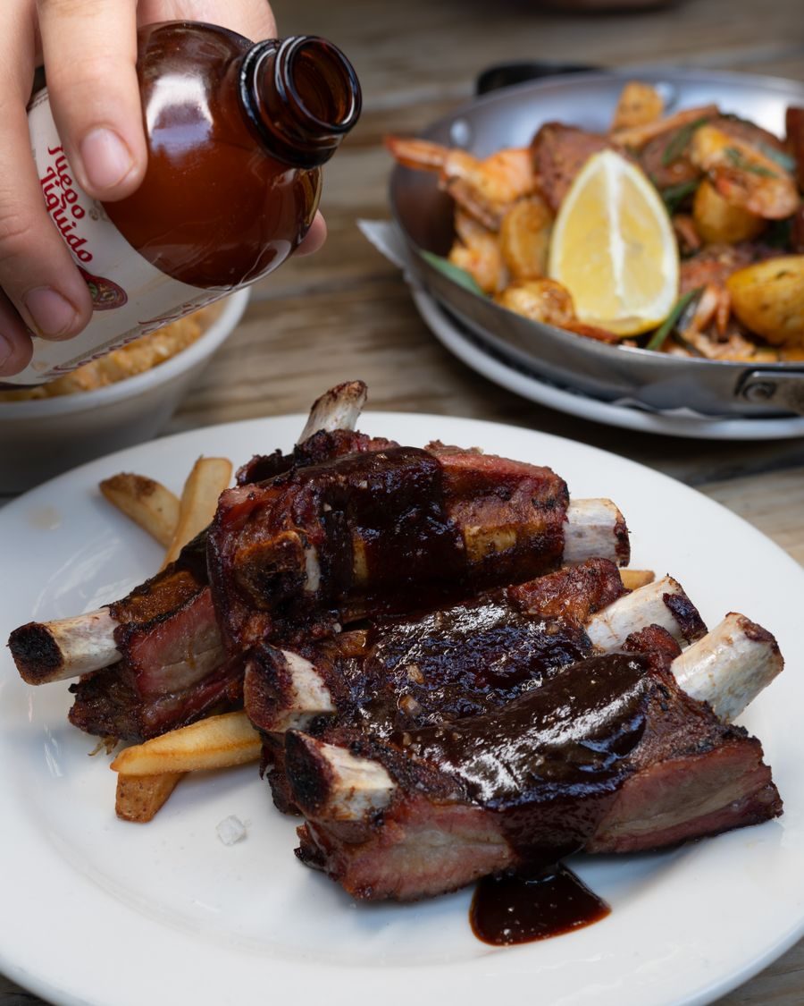 BBQ ribs being glazed
